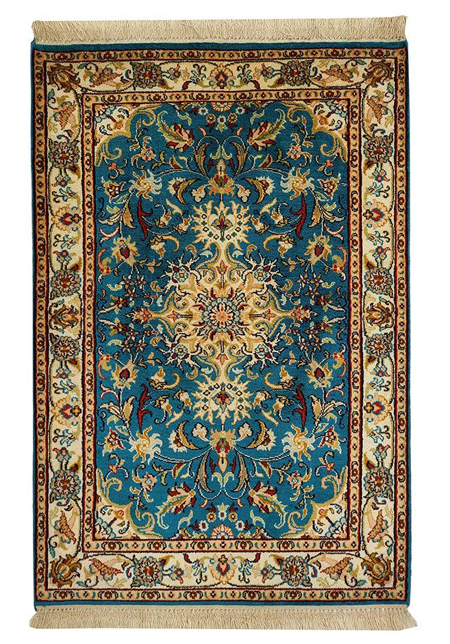 Persian-inspired blue and gold rug with intricate floral design and central medallion pattern, featuring ornate borders and vibrant colors, perfect for adding luxury to home decor.